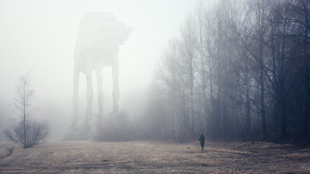 A Star Wars AT-AT walker barely visible in misty autumn field. There is a dog walker minding their own business in the picture. 